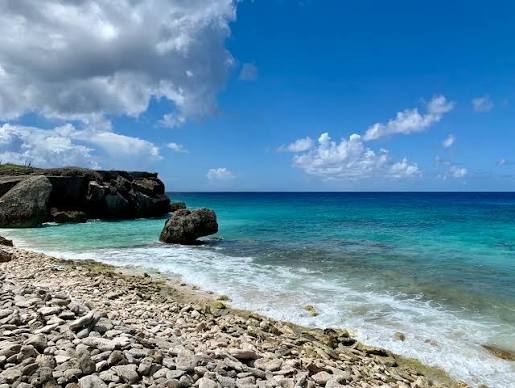 A Dutch minister heads to Bonaire, where a landmark climate ruling still hangs in the air